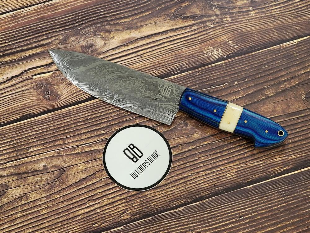 This limited edition handmade 6" Damascus Chef's Utility knife is part of the Butcher's Blade Summer 2021 Damascus series of knives. Each knife is handmade and no two handle are 100% identical, they are the same pattern and material but since they are made by hand there will be very slight variances if yo compare 2 side by side.  This Knife is made of 420 layers of High Carbon Damascus steel with any 6" blade and 5" handle. Each knife come in a wooden storage box.