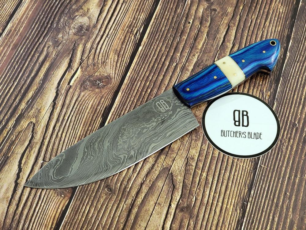 This limited edition handmade 6" Damascus Chef's Utility knife is part of the Butcher's Blade Summer 2021 Damascus series of knives. Each knife is handmade and no two handle are 100% identical, they are the same pattern and material but since they are made by hand there will be very slight variances if yo compare 2 side by side.  This Knife is made of 420 layers of High Carbon Damascus steel with any 6" blade and 5" handle. Each knife come in a wooden storage box.